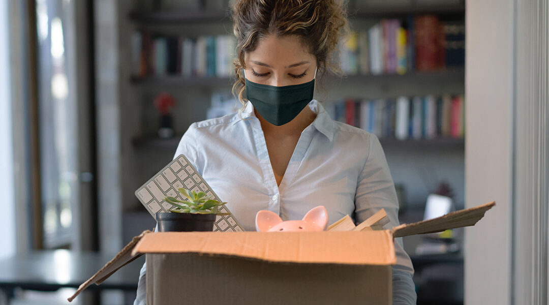 Woman packing up her desk at work